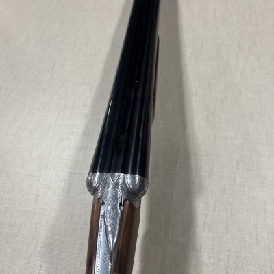 Espingarda dupla cano com madeira e metal gravado