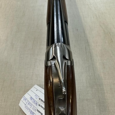 espingarda canos duplos com coronha em madeira e acabamento metálico