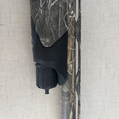 Arma de fogo camuflada com detalhe preto e texto EXTREME X7