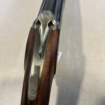 Arma de fogo dupla com madeira e metal