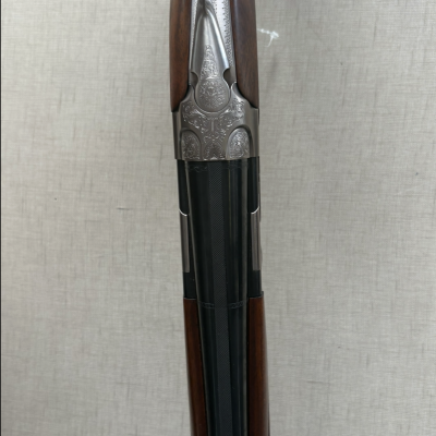 Espingarda de canos duplos com madeira e metal decorado