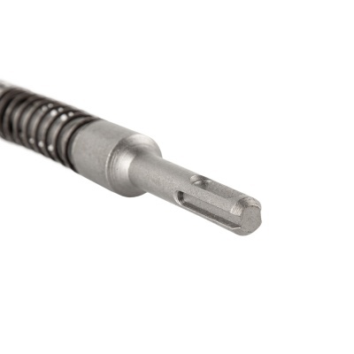 Ferramenta metálica com mola preta e ponta cinza sobre fundo branco