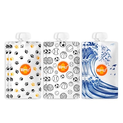 Três embalagens flexíveis com diferentes padrões e rótulo laranja Greenies