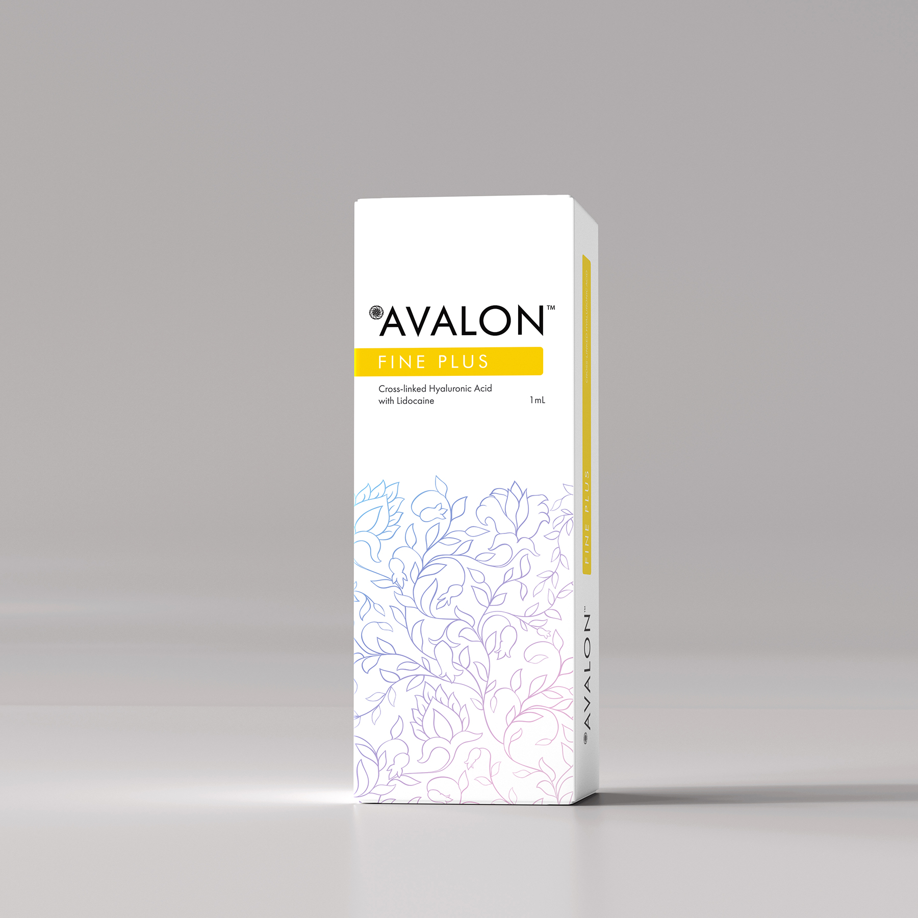 Embalagem branca com padrão floral azul claro e rosa, texto da marca AVALON FINE PLUS e faixa amarela