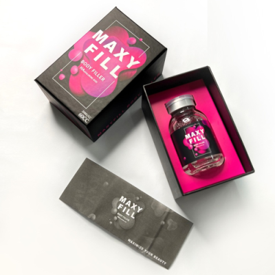 Frasco de vidro MAXY FILL BODY FILLER dentro de embalagem preta e rosa com folheto informativo