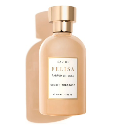 Frasco de perfume beige com tampa dourada e etiqueta branca com texto