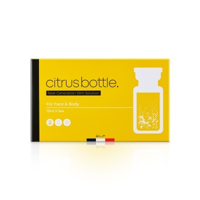 Embalagem amarela e preta do produto citrus bottle para rosto e corpo com texto e ícones distintos