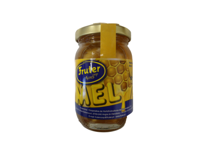 Frasco de mel com tampa dourada e etiqueta amarela e azul com texto
