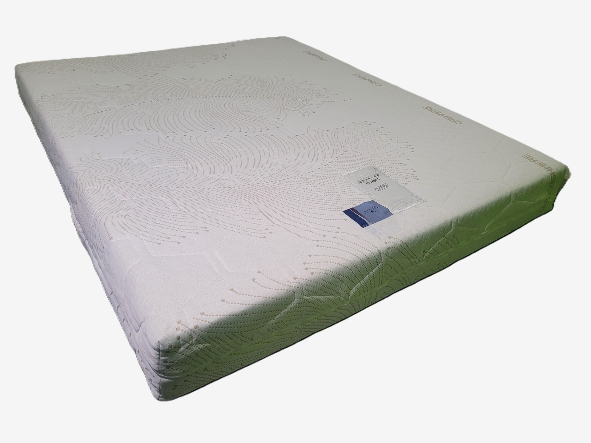 Colchão branco com padrão texturizado e etiquetas visíveis