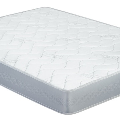 Colchão branco com laterais cinzentas, padrão matelassê ondulado e etiqueta lateral