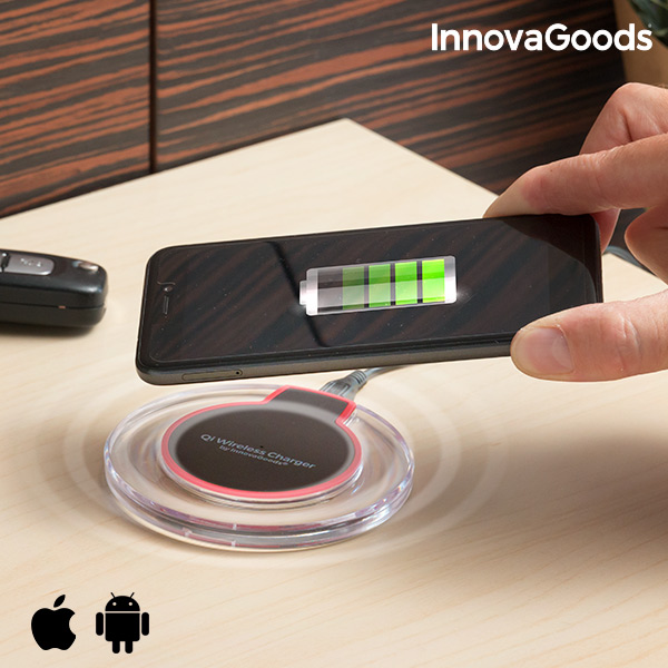 Carregador Sem Fios para Smartphones Qi InnovaGoods Carregador wireless redondo transparente a carregar smartphone preto com ícone de bateria verde no ecrã