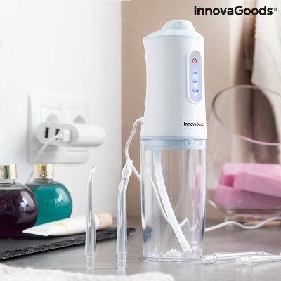 Irrigador oral branco e transparente InnovaGoods com vários bicos em bancada