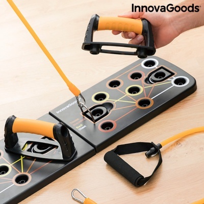 Equipamento portátil de fitness InnovaGoods com bases pretas, elásticos laranja e pegas amarelas e pretas.