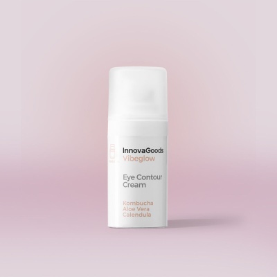 Frasco branco de creme para contorno dos olhos InnovaGoods Vibeglow sobre fundo rosa claro