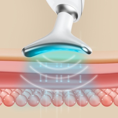 Dispositivo branco e azul emitindo luz sobre tecido e células cor de rosa