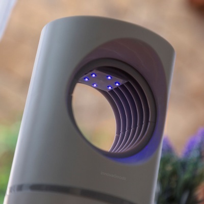 Dispositivo branco cilíndrico com luzes LED azuis interno