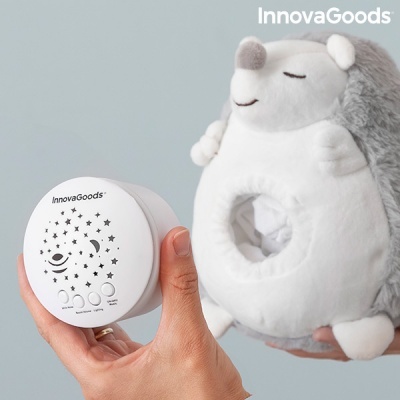 Dispositivo branco InnovaGoods com botões e ouriço de pelúcia cinzento e branco em fundo cinzento