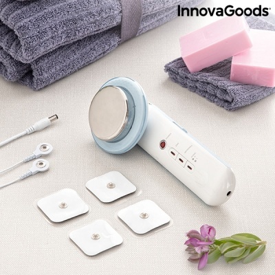 Dispositivo eletrônico branco e azul com eletrodos e toalhas cinzentas