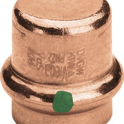 Componente metálico cobre com marcações e uma marca verde