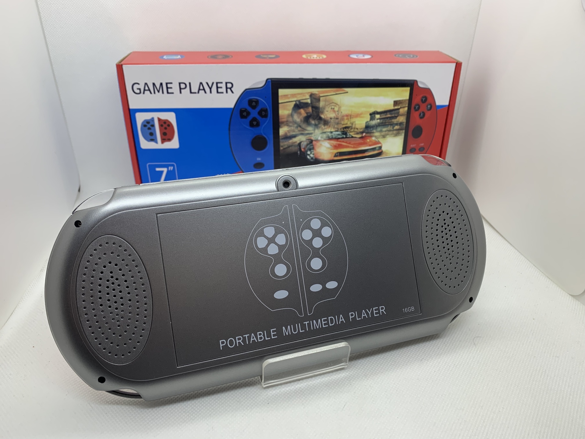 Consola Retro X12 Plus Consola portátil cinzenta com altifalantes e caixa vermelha e azul ao fundo