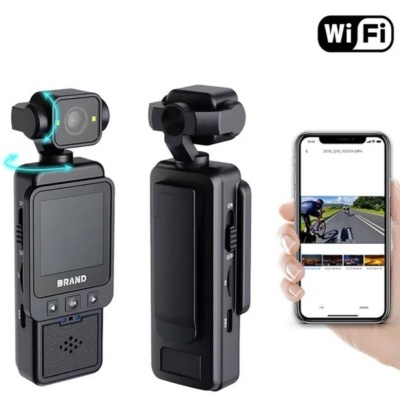 Câmara de vídeo preta com lente rotativa, ecrã e smartphone a mostrar vídeo.