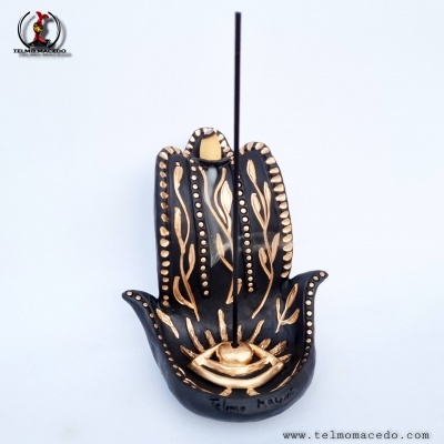 Incensário em forma de mão Hamsá preto com detalhes dourados e suporte para incenso