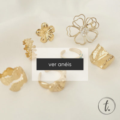 sete anéis dourados variados sobre fundo branco com texto 'ver anéis'