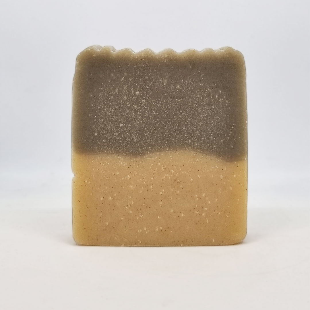 Sabonete de Vetiver e Argila Negra Sabonete retangular bicolor com textura granulada