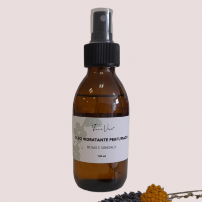 Frasco de óleo hidratante perfumado com spray preto sobre fundo rosa claro com flores secas