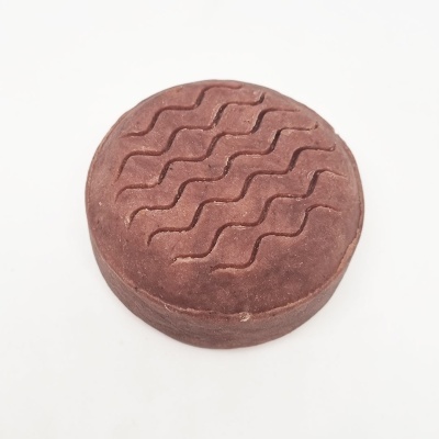 Penteadeira redonda castanha com padrão ondulado em superfície de couro sintético