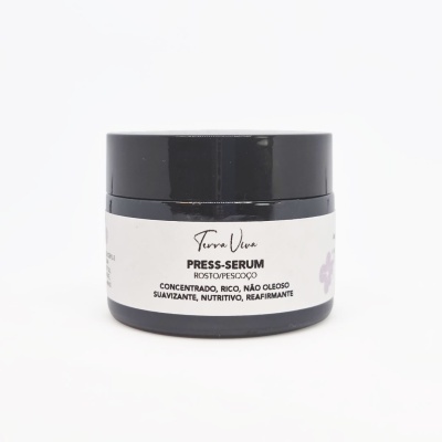 Frasco preto com etiqueta branca e texto de serum para rosto e pescoço