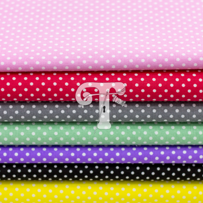 Tecido com padrão de bolinhas coloridas