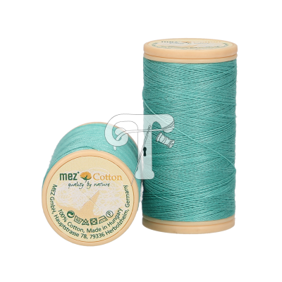 Dois carretéis de linha de algodão azul turquesa da marca mez com tampas bege