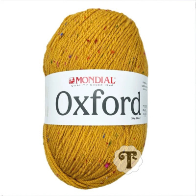 Novelo de lã amarelo mostarda com confetos coloridos da marca MONDIAL Oxford