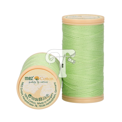 Dois carretéis de linha verde claro com rótulos bege e texto 'mez Cotton'.