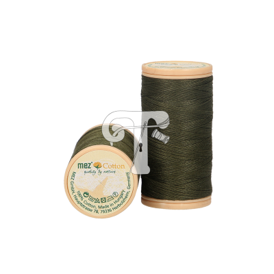 Dois carretéis de linha de algodão verde escuro com tampas bege