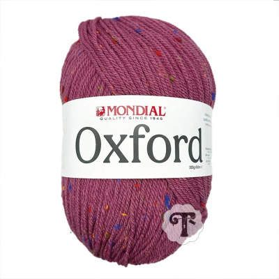 Ovillo de lã roxa com pontos coloridos e etiqueta branca da Mondial Oxford