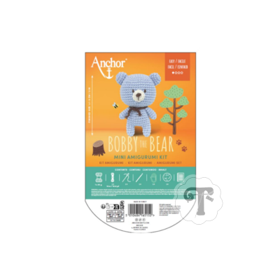 Kit de amigurumi para fazer um urso azul com embalagem laranja e verde