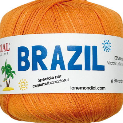 Novelo de fio laranja com etiqueta BRAZIL