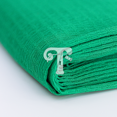Tecido verde texturizado dobrado