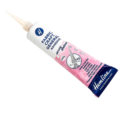 Cola adesiva para tecido e artesanato Hemline em tubo rosa e branco