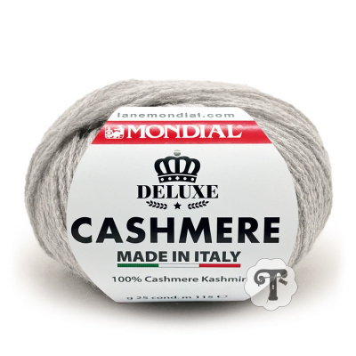 Novelo de lã cinzenta clara Mondial Deluxe Cashmere com rótulo branco e vermelho