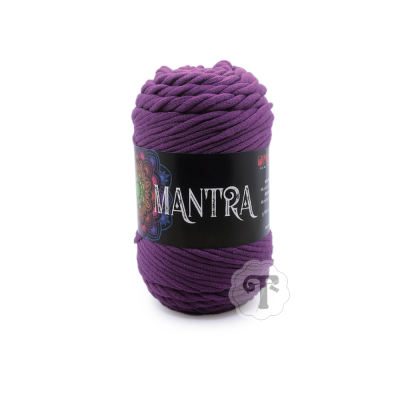 Skein of purple yarn labeled MANTRA with mandala design on black label