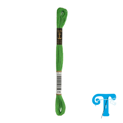 Skein of bright green embroidery thread with anchor label and barcode