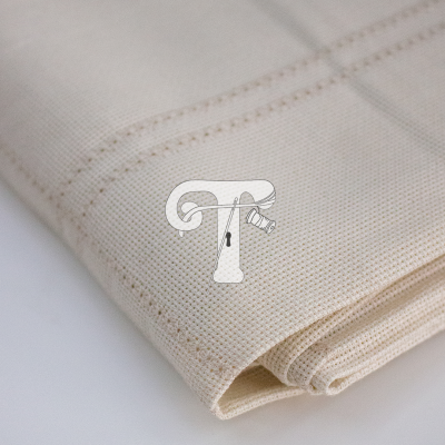 Tecido cru em algodão com textura e costura castanha