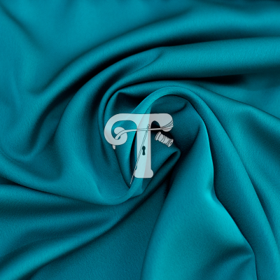 tecido azul turquesa com pregador branco