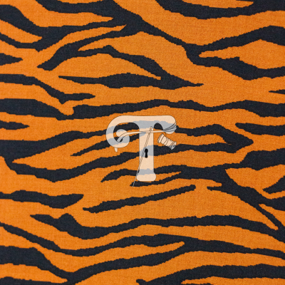 Pano com padrão de riscas de tigre laranja e preto