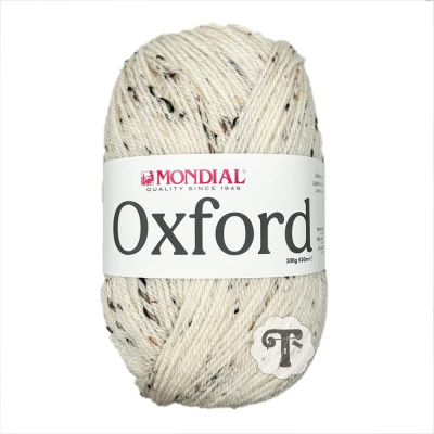 Novelo de lã branco com pintas castanhas e pretas da marca MONDIAL