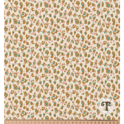 Tecido estampado creme com motivos castanhos e verdes e régua de escala