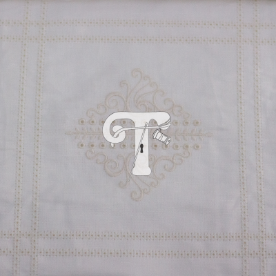 Tecido branco com bordado bege geométrico e ornamental no centro